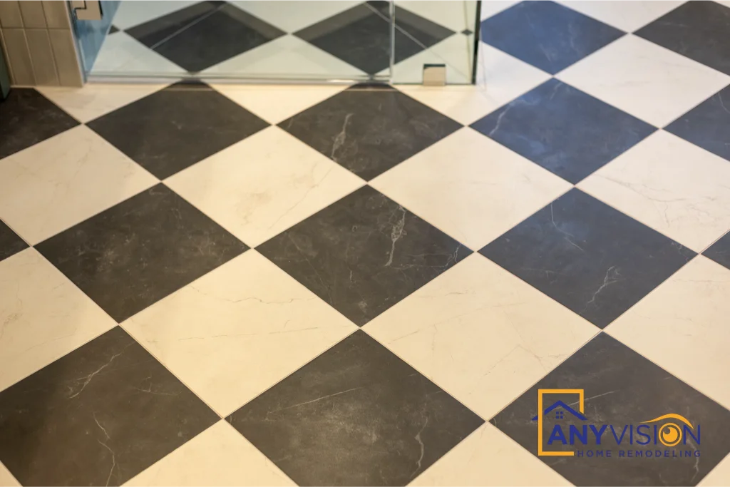 Checkerboard marble floor running to the shower threshold