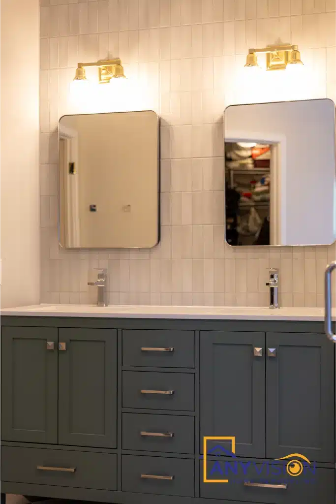 Double vanity with twin mirrors and wall sconces