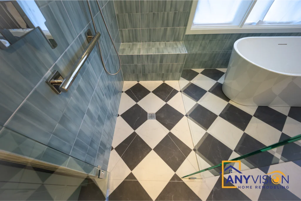 Shower, tub and checkerboard floor seen together across the finished bathroom