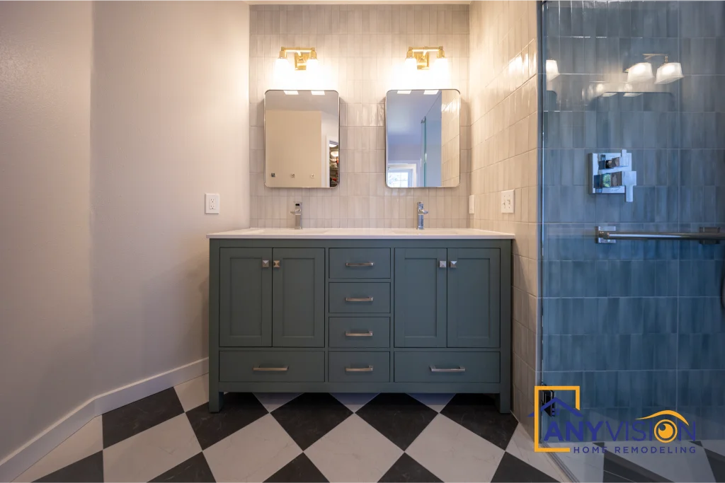 Grey-green double vanity with twin mirrors and wall sconces