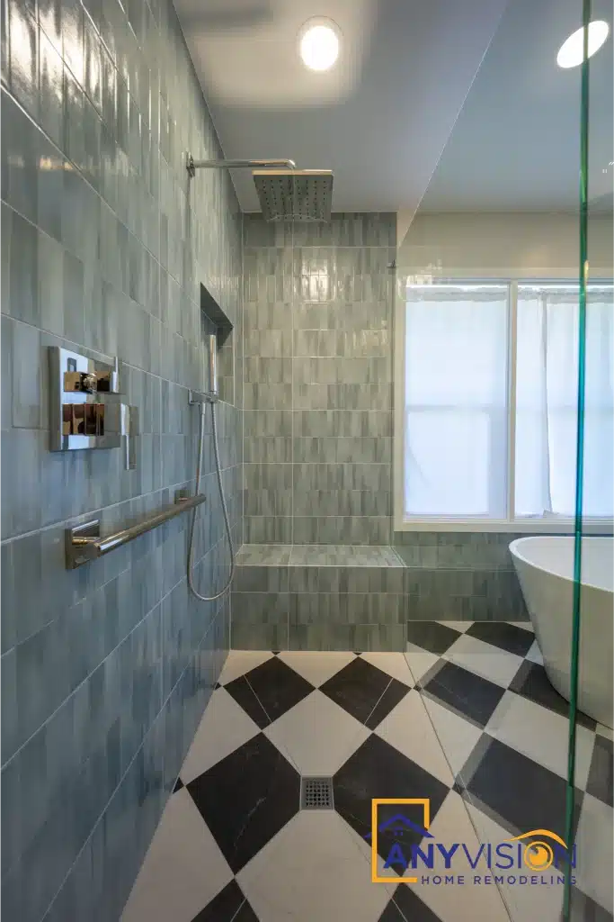 Shower enclosure with glass panel and grab rail