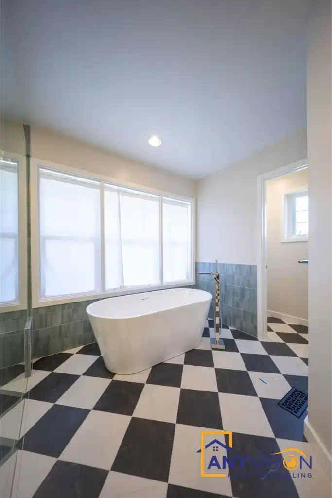 Freestanding tub against the window wall
