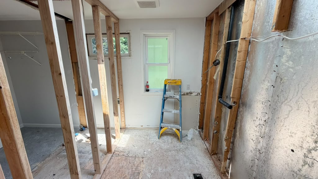 Framed openings replacing the original hallway walls in a Redmond split-level