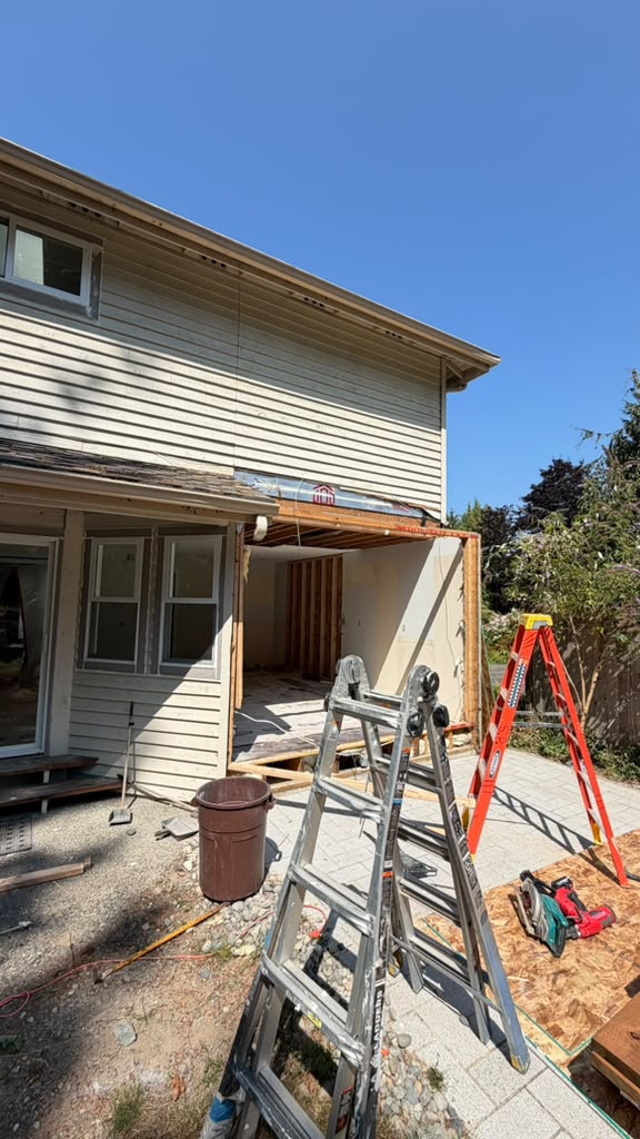 Exterior of a Redmond split-level opened up for a second-story structural addition