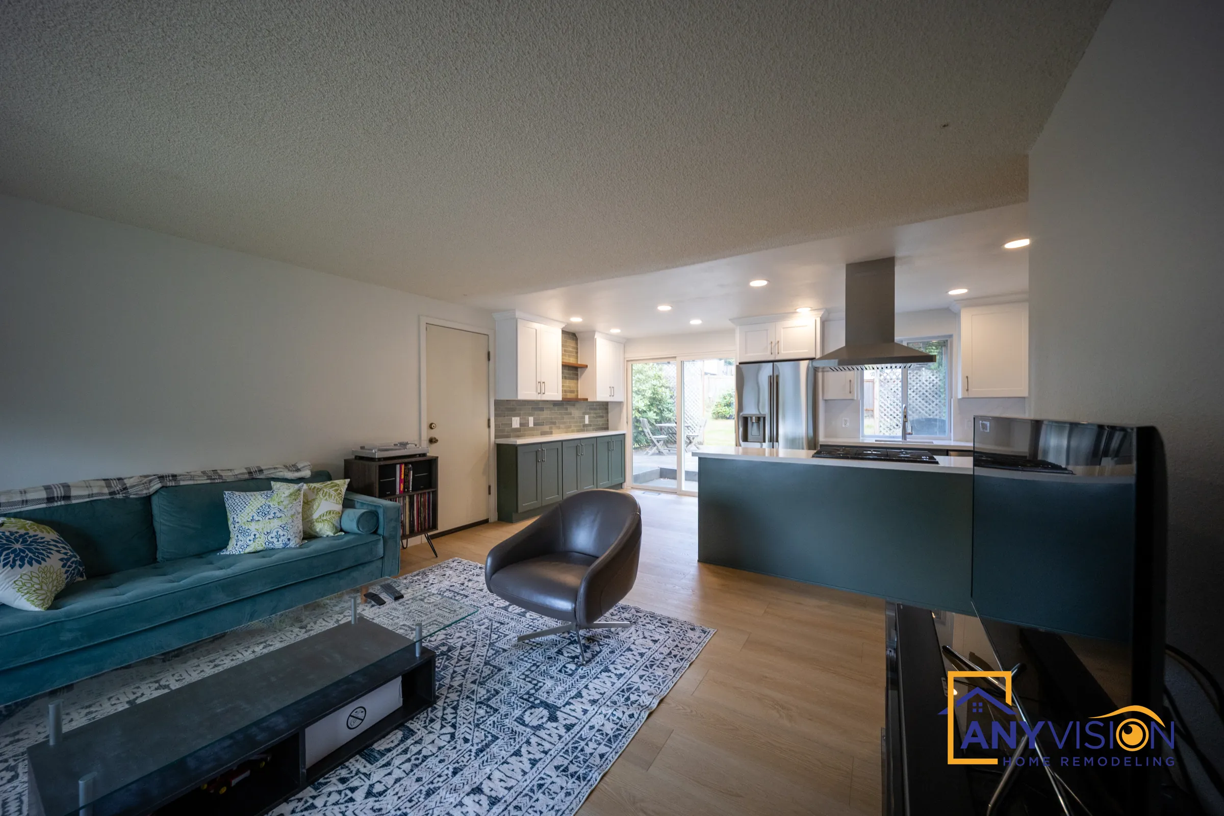 Living room opening onto the remodeled kitchen and island