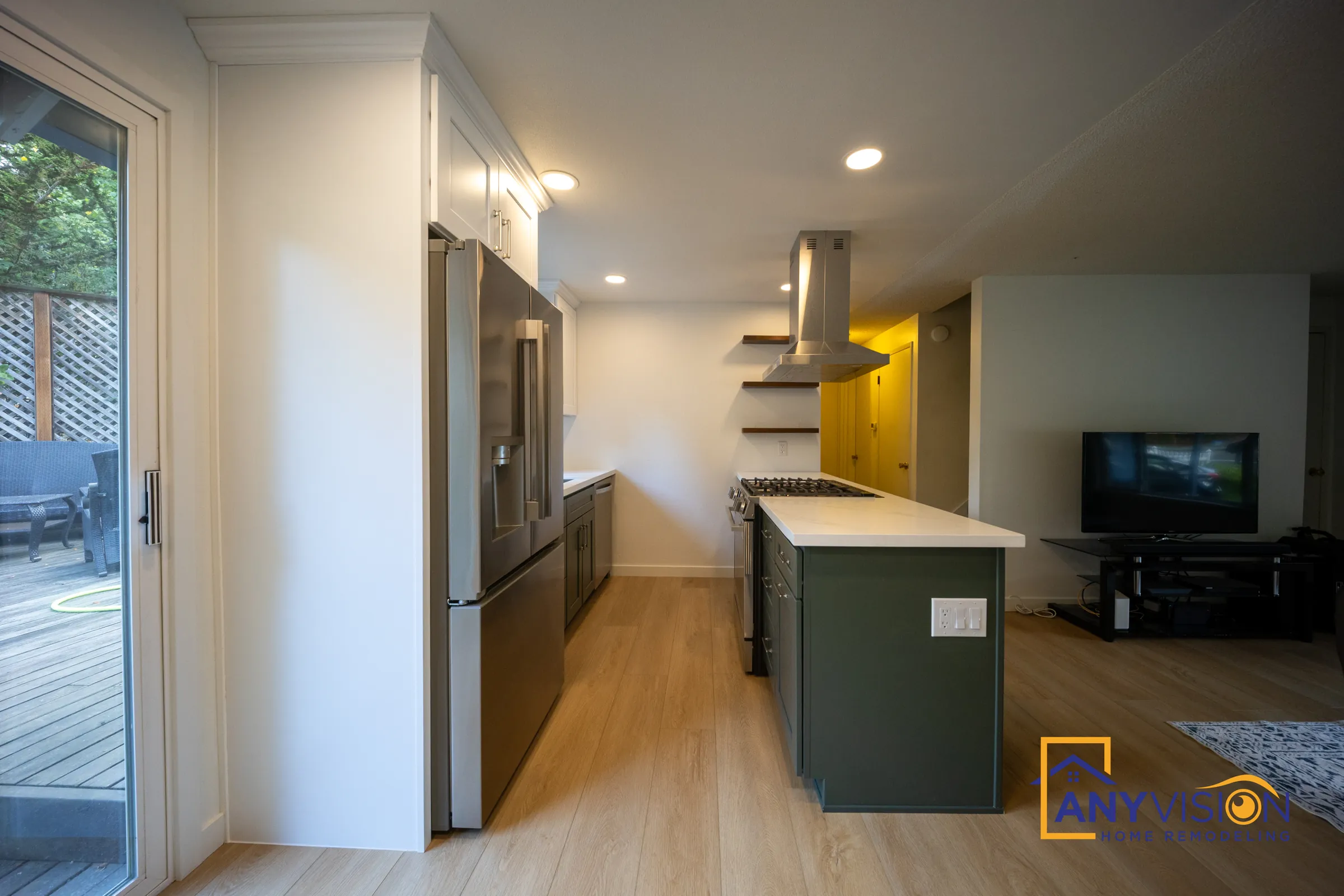 Kitchen with sliding doors to the deck and the island in the foreground