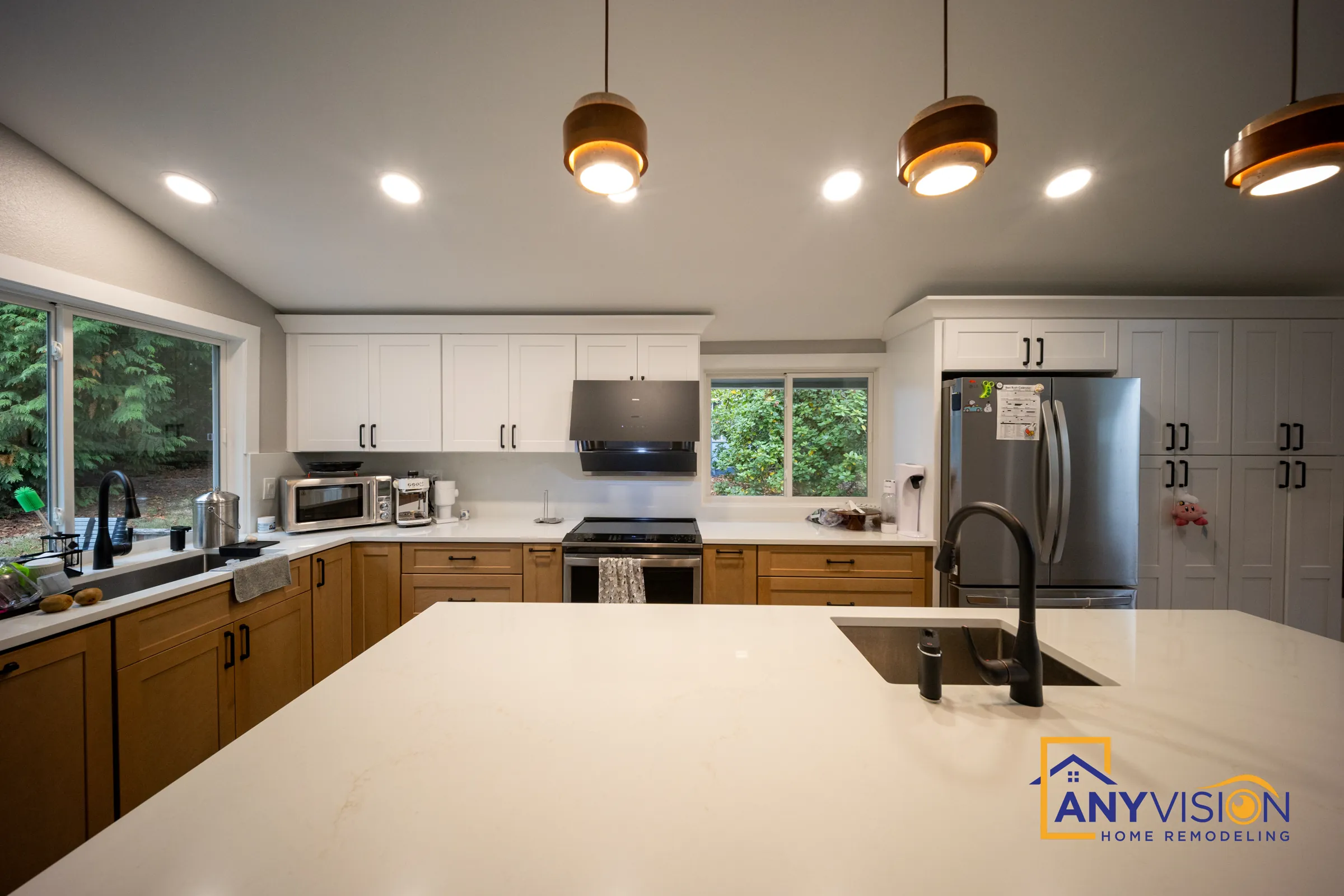 Island view toward the range wall with copper pendants overhead