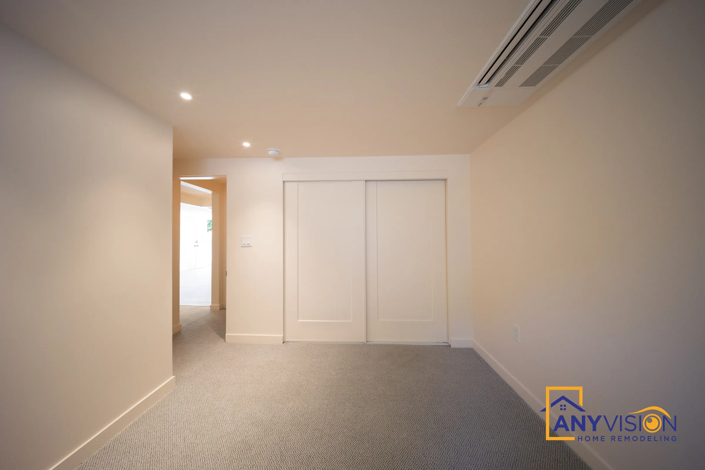 Finished basement bedroom with carpet, recessed lighting and a double sliding closet